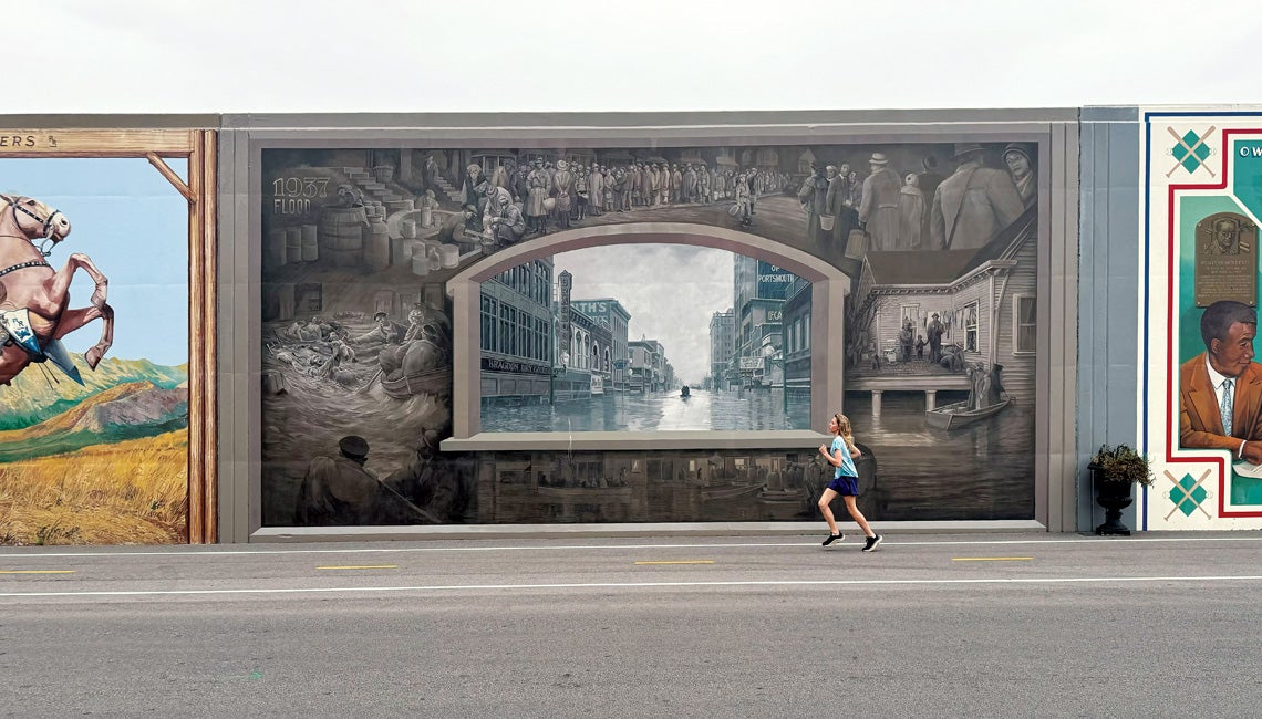 Runner in front of Portsmouth's iconic mural wall