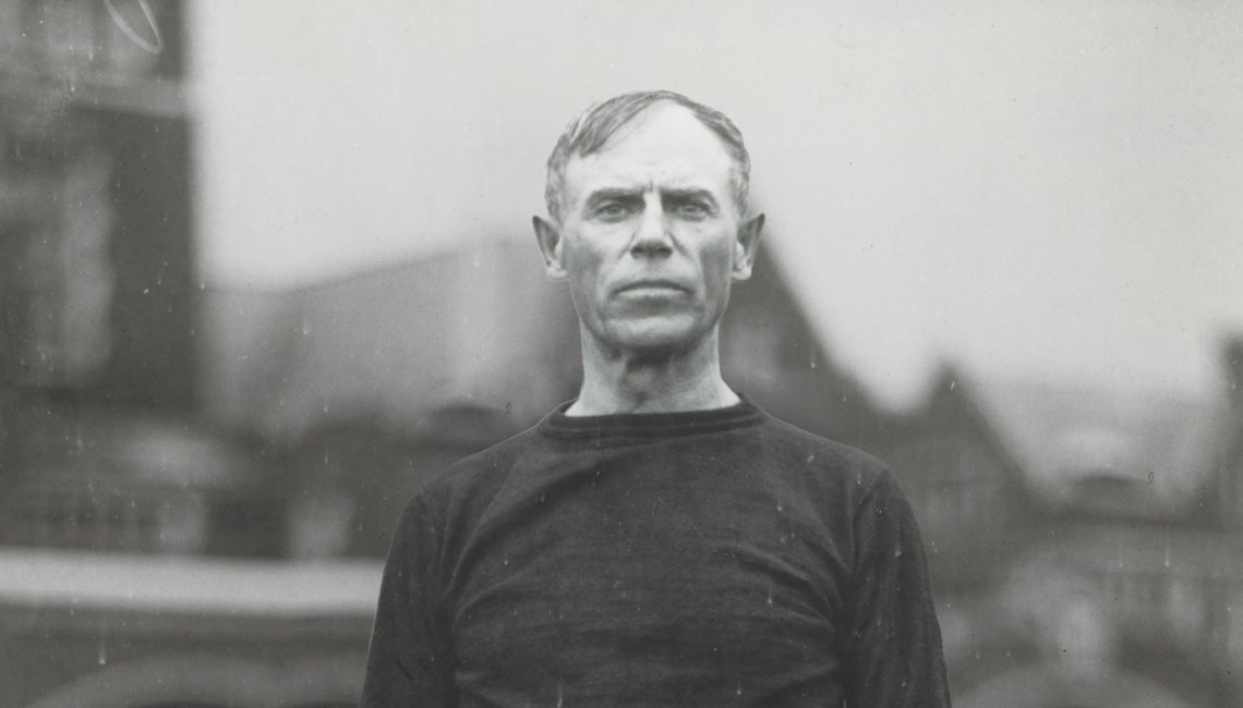 A black and white photo of John Heisman
