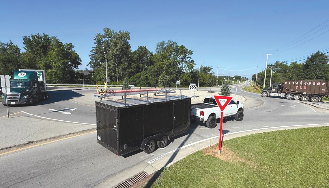 Vehicles driving through a roundabout