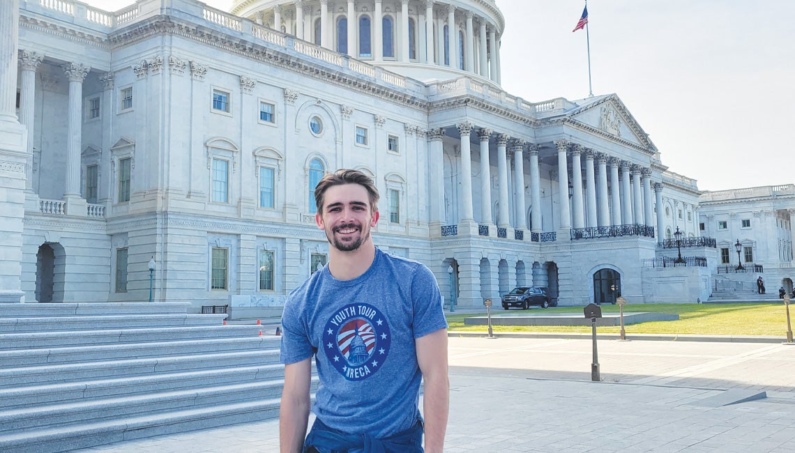 Kyle Hicks posing in front of the U.S. Capitol