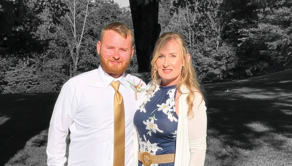 A black and white photo of a mother and adult son