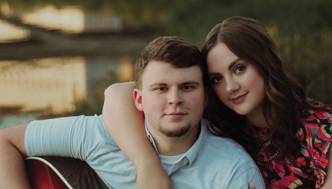 A young couple posing for a photo