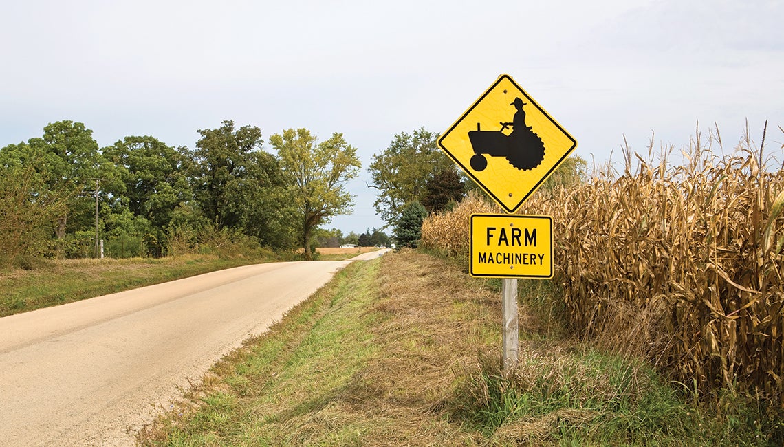 Farm machinery sign on rural road (Credit: Getty Images)