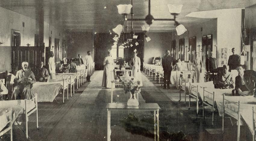 An old black and white picture of the hospital ward.