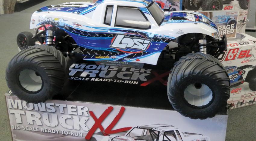 A radio-controlled monster truck sits on display.