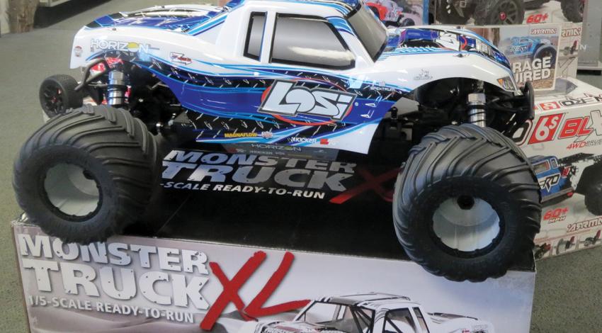 A radio-controlled monster truck sits on display.