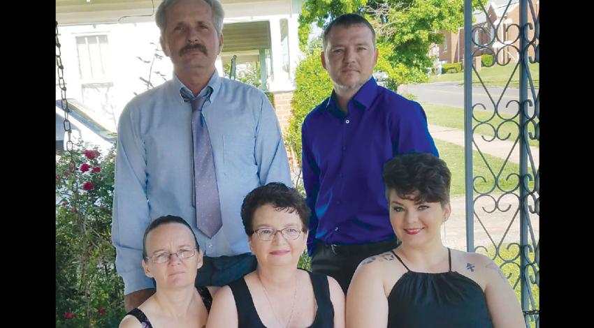 Chris Landers, top right, and his mother, Mary, bottom center, with his siblings and father last May. Landers, a lineman from Oklahoma, was killed on the job in 2017. (Photo courtesy of Mary Allison)