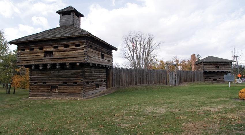 A picture of the wooden fort and fence of Fort Recovery.