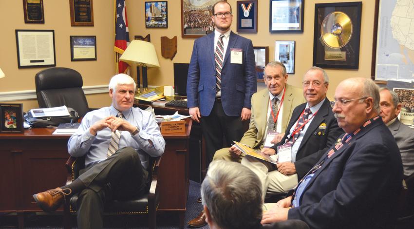 Cooperative leaders sit with U.S. Rep. Bob Gibbs