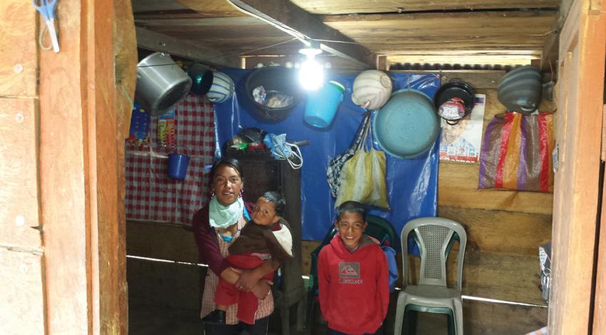 A family in Guatemala poses together for a picture.