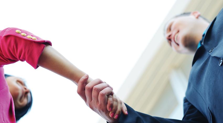 Two people shaking hands.