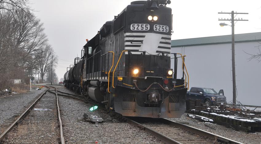 Engine 5255, a 100-ton locomotive, sits on the tracks.