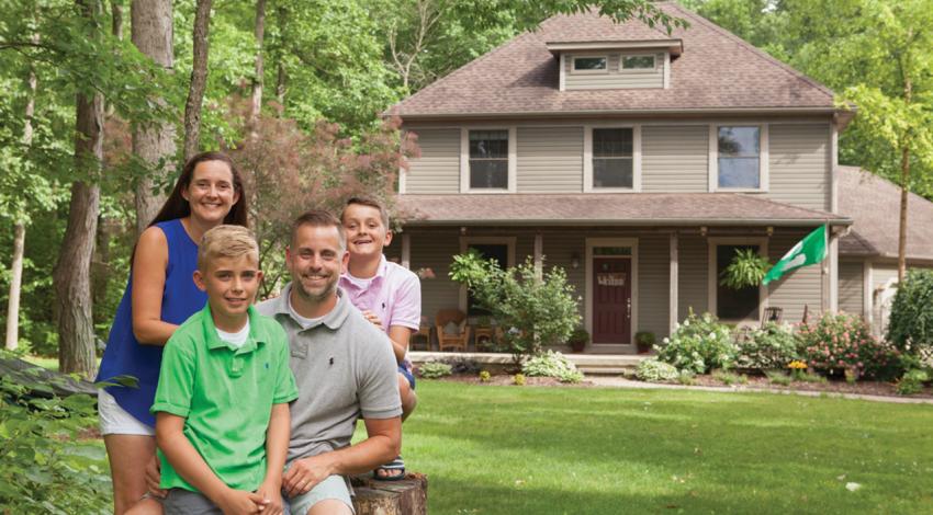 Rebecca and Ben Wever smile with their two sons.