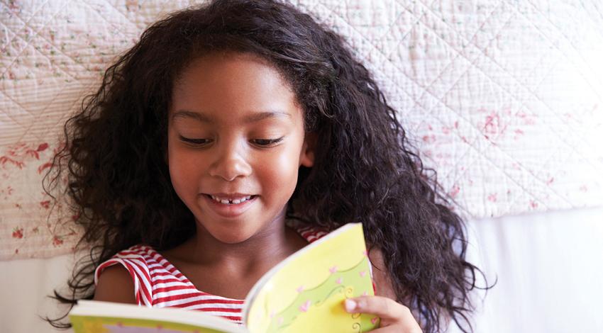 Girl reading a book (Credit: Getty Images)