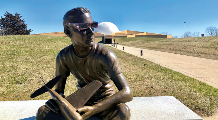 Chas Fagan’s bronze statue of 15-year-old Neil Armstrong — ready for the eclipse (photo courtesy of the Armstrong Air and Space Museum).