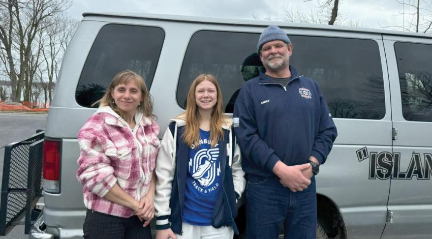 The Skeans family posing with their rideshare van
