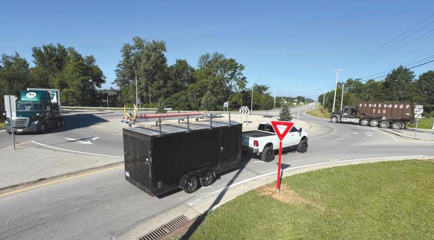 Vehicles driving through a roundabout
