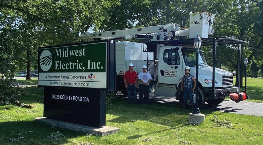tree-trimmers in front of truck