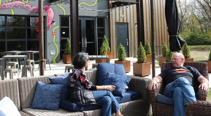 Couple sitting outside BrewDog's Doghouse