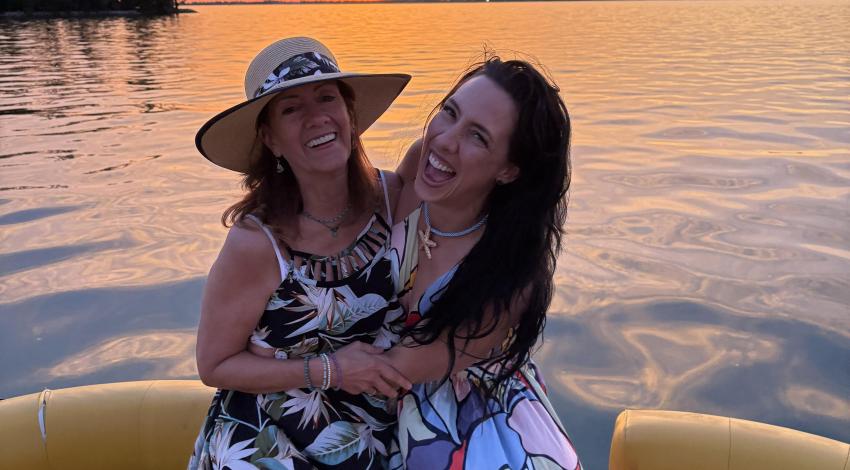 two smiling women on a boat