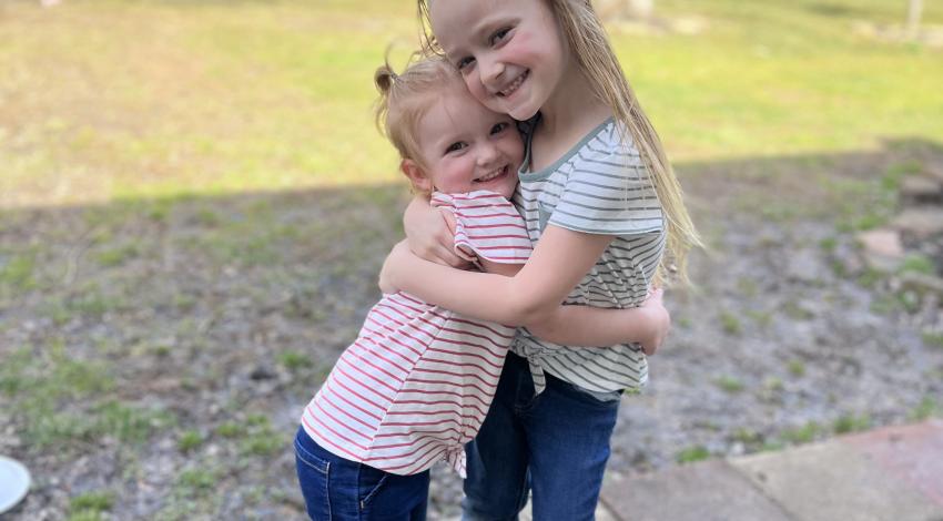 two little girls hugging
