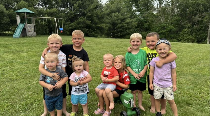 group of children on grass in yard