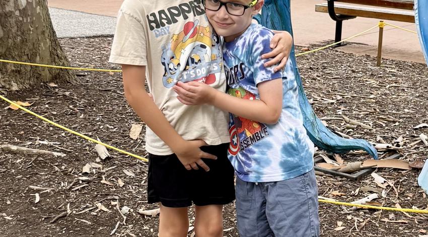 two boys hugging