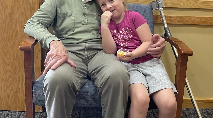 older an and young girl in chair
