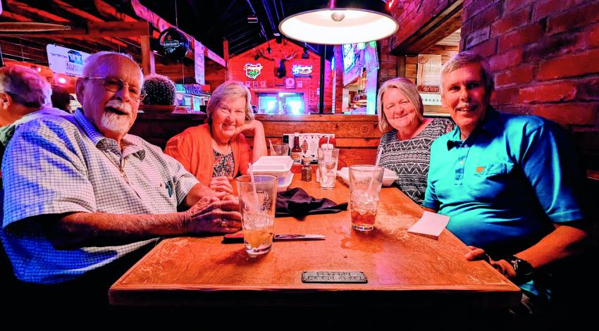 two couples at restaurant table