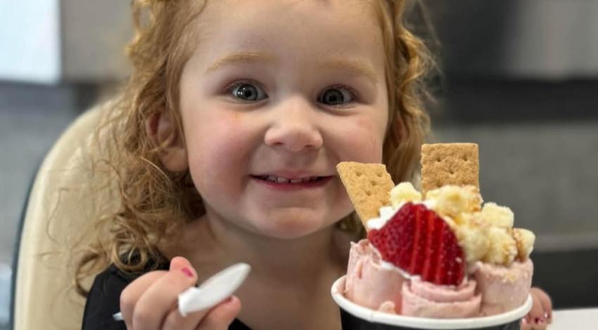 smiling little girl with ice cream 