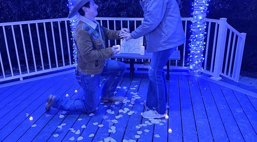 man proposing to woman in gazebo