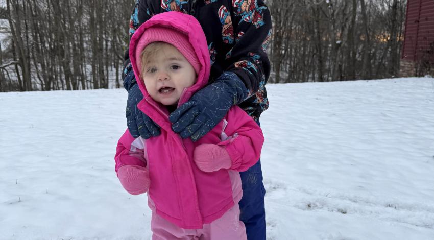 two smiling children in snow