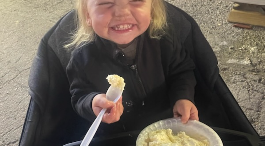 smiling girl with bowl of ice cream