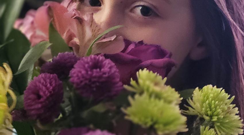 girl holding flowers
