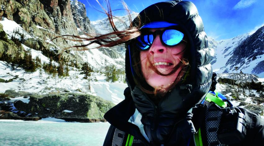 woman with snowy mountains in background