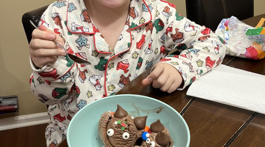 smiling girl with bowl of ice cream with candies