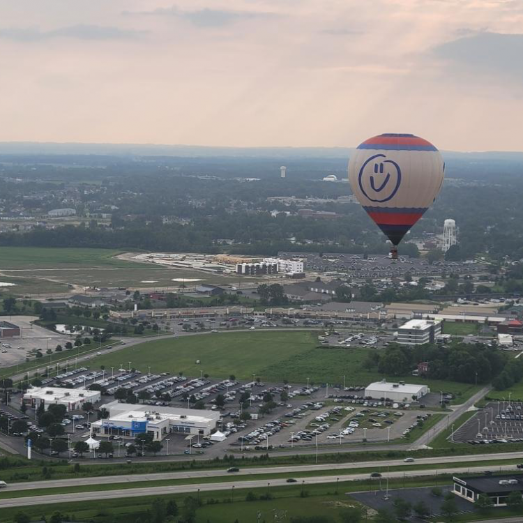 "Otto" smiles down on the city as he flies 1,000 feet over Route 33 after taking off from Honda of Marysville. Photo credit: Trent Bishop