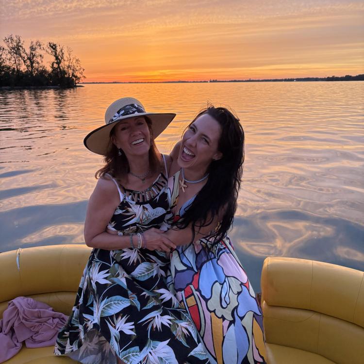 two smiling women on a boat
