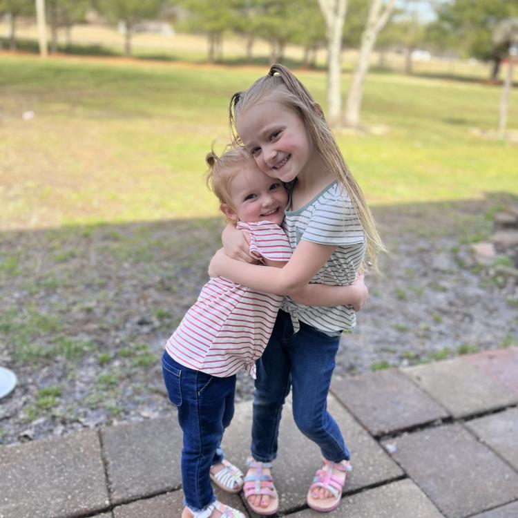 two little girls hugging