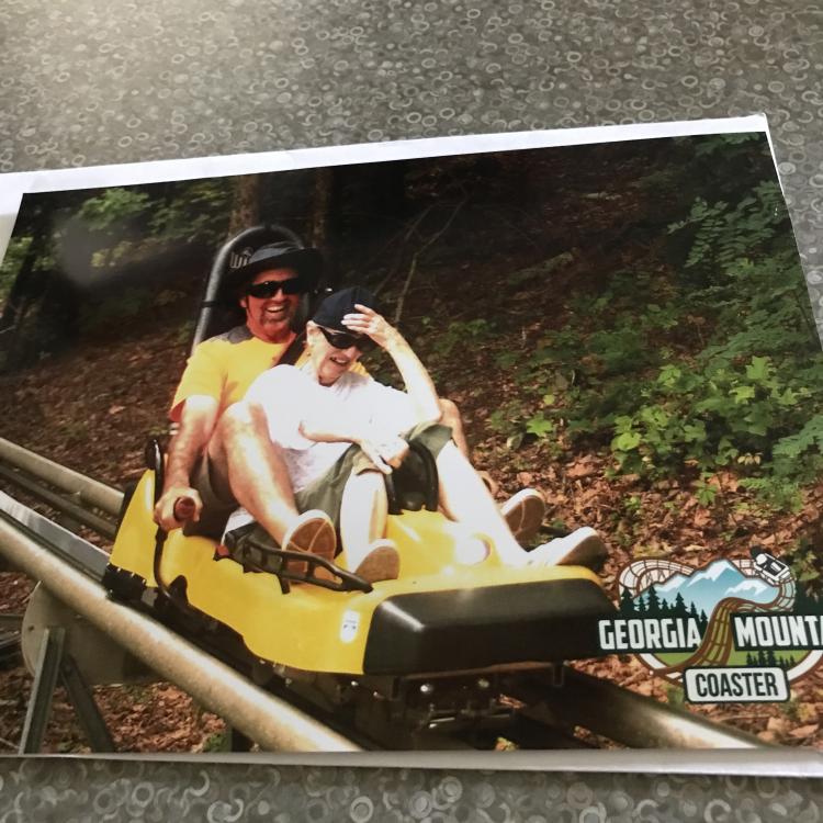 Man and woman on mountain coaster