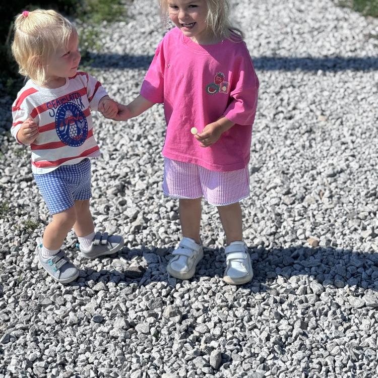 two little girls holding hands