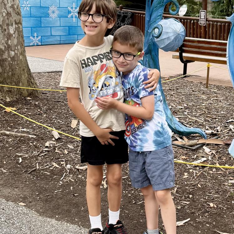 two boys hugging