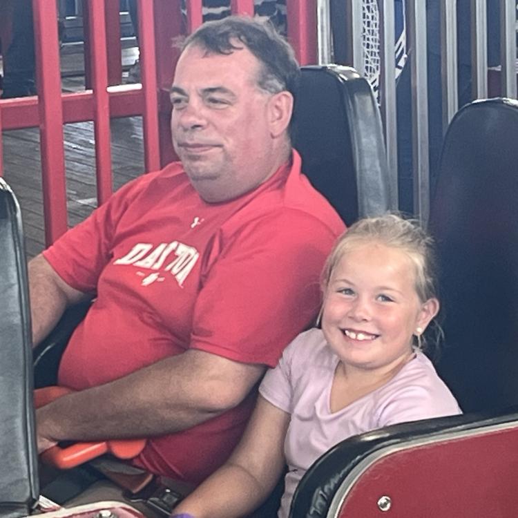 girl and man on roller coaster