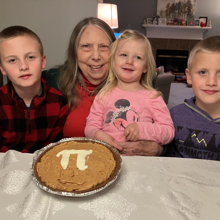 woman and three children with Pi pie