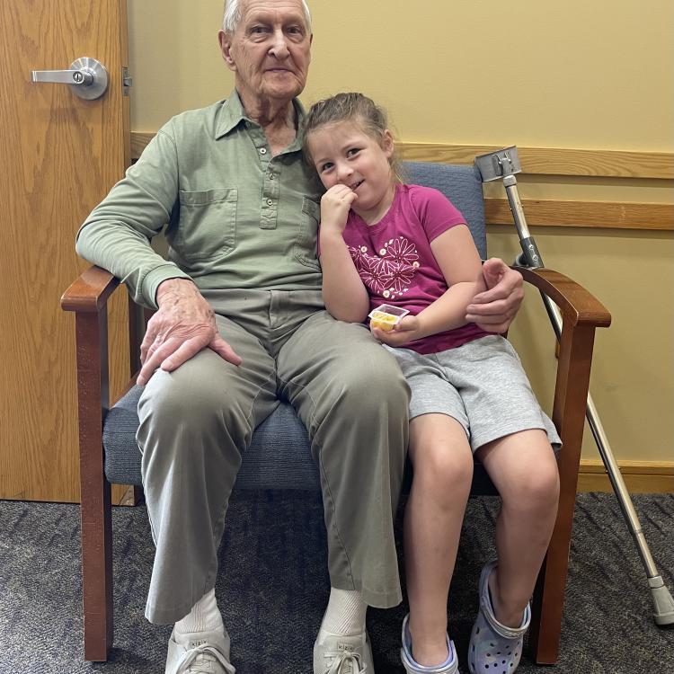 older an and young girl in chair