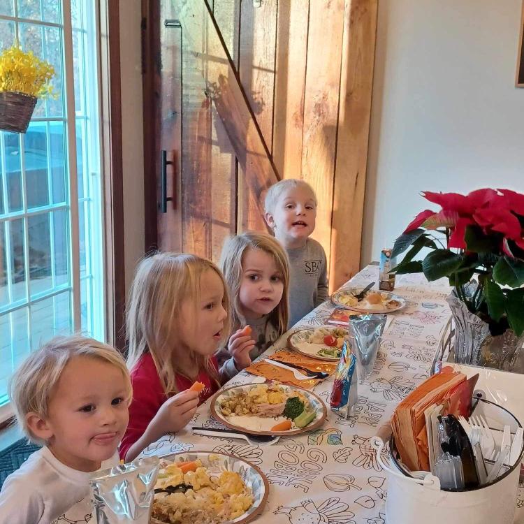 four children at table