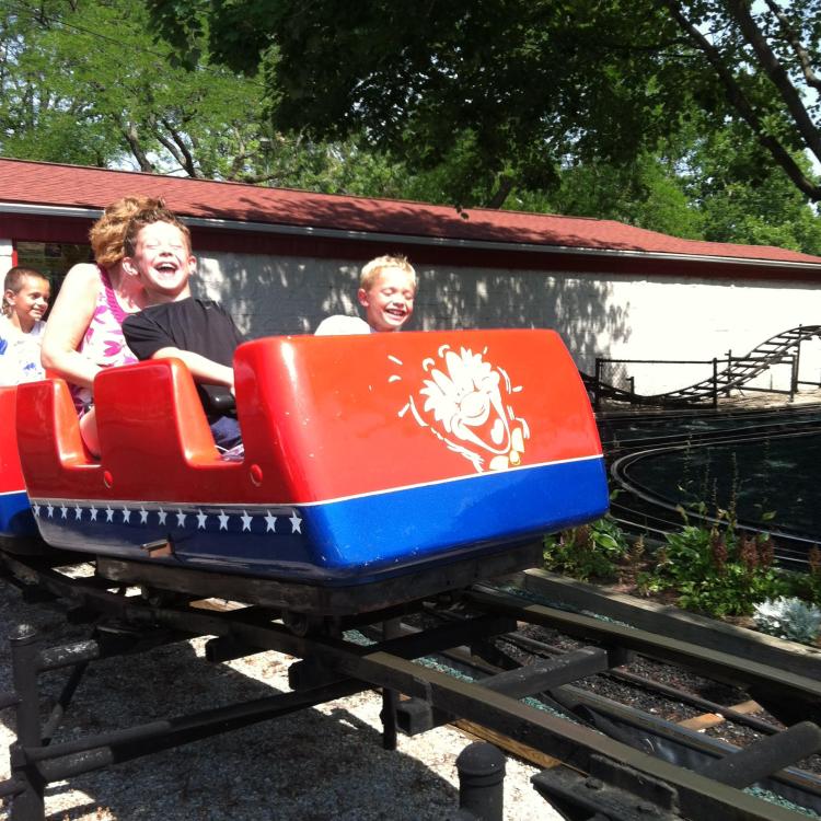 little boys on red roller coaster