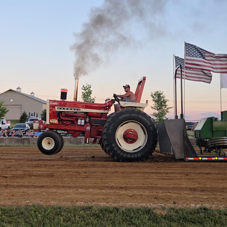red tractor with American flags