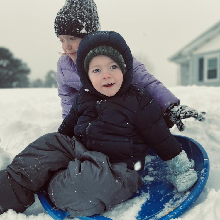 two children sledding