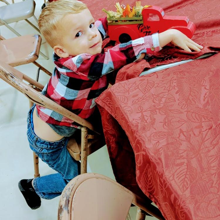 little boy at table